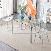 Modern minimalist glass dining table. A transparent tempered glass desktop with a thickness of 0.3 feet and silver metal legs. Suitable for restaurants and living rooms.   51"*31.4"*29.5"