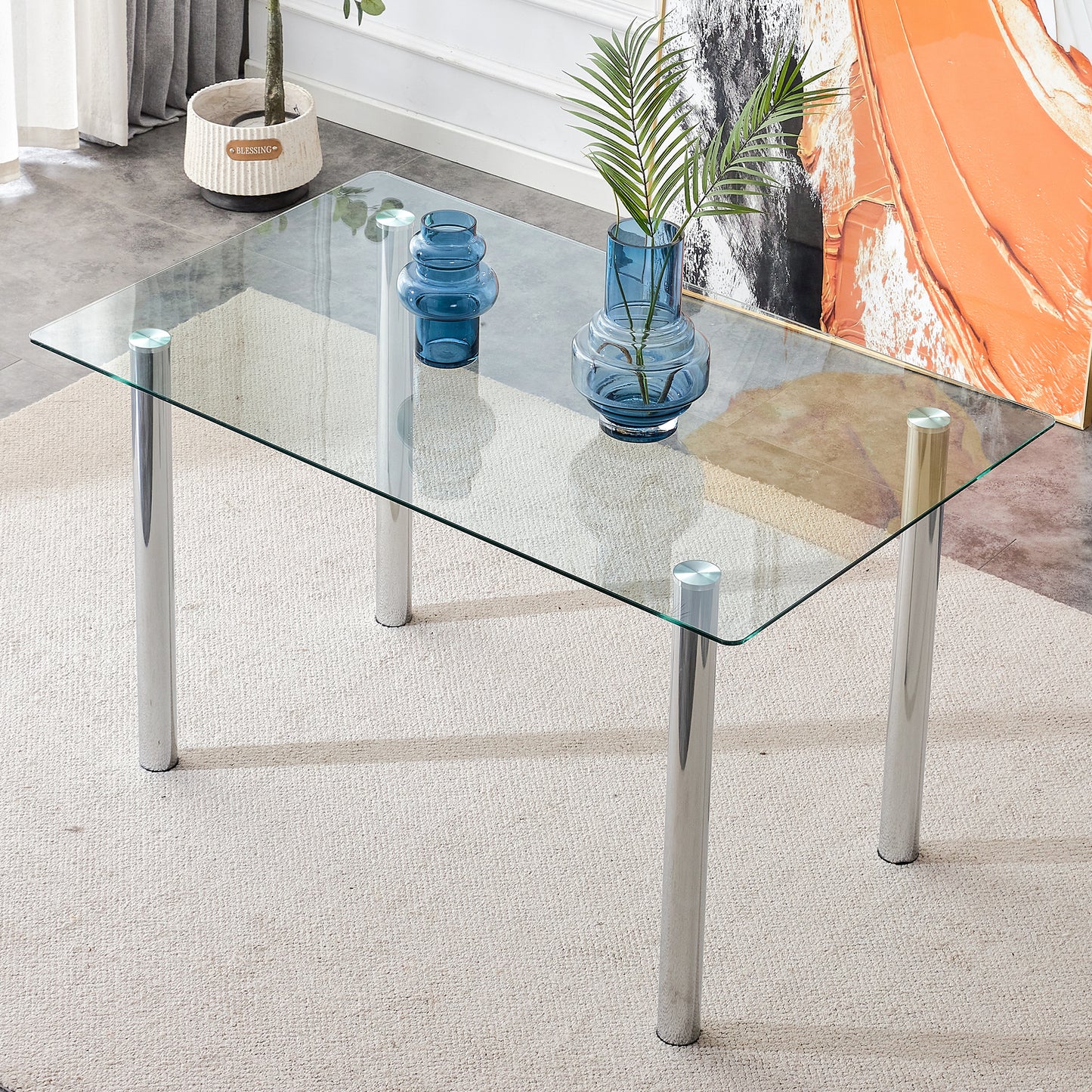 Modern minimalist glass dining table. A transparent tempered glass desktop with a thickness of 0.3 feet and silver metal legs. Suitable for restaurants and living rooms.   51"*31.4"*29.5"